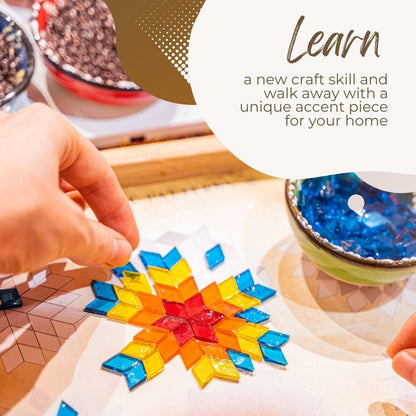 Handcrafting a colorful star-shaped design with mosaic tiles on a table.